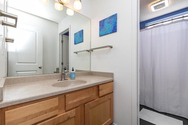 13001 Twana Dr, Urbandale, IA 50323 - bathroom with vanity and curtained shower