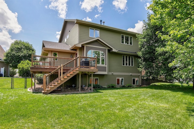 13001 Twana Dr, Urbandale, IA 50323 - back of property featuring stairway and a wooden deck