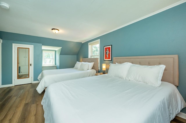 512 11th St, West Des Moines, IA 50265 - bedroom featuring dark wood finished floors, multiple windows, and vaulted ceiling