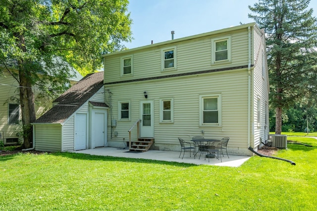 512 11th St, West Des Moines, IA 50265 - back of house featuring entry steps, a patio area, a lawn, and an outbuilding