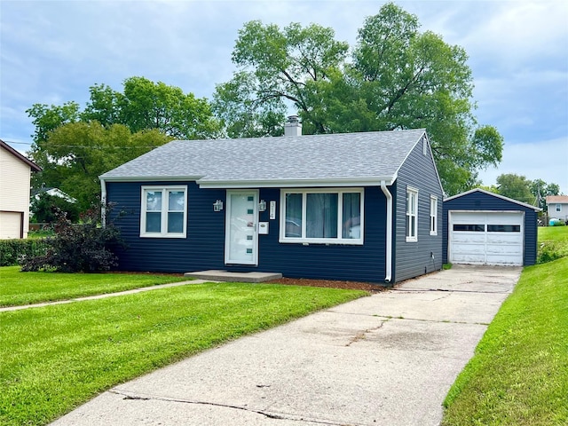 314 E 14th St N, Newton, IA 50208 - view of front of property with an outdoor structure, a garage, concrete driveway, a chimney, and a front yard