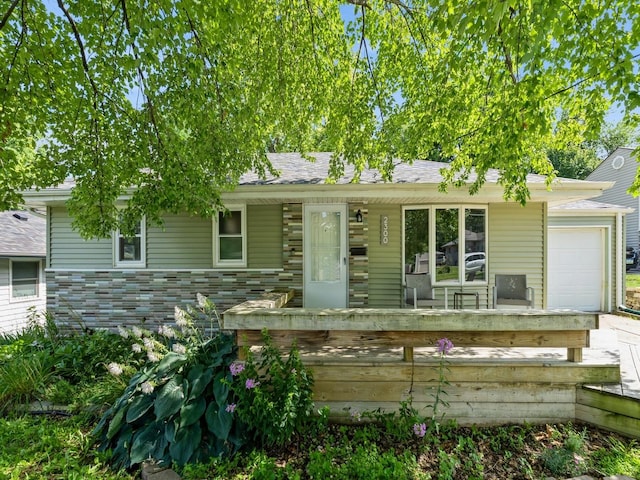 2300 Locust St, West Des Moines, IA 50265 - view of front facade featuring a garage and a porch