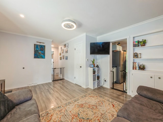 2300 Locust St, West Des Moines, IA 50265 - living room featuring ornamental molding and wood finished floors