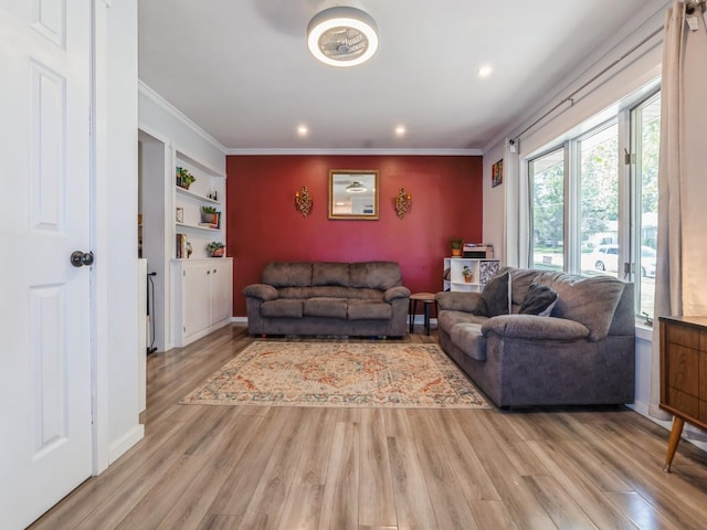 2300 Locust St, West Des Moines, IA 50265 - living area with light wood-style flooring, recessed lighting, crown molding, and built in features