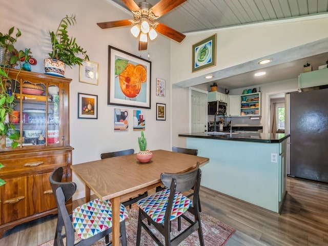 2300 Locust St, West Des Moines, IA 50265 - dining space with a ceiling fan, wood finished floors, and vaulted ceiling