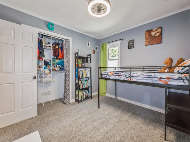 2300 Locust St, West Des Moines, IA 50265 - carpeted bedroom with crown molding and a closet