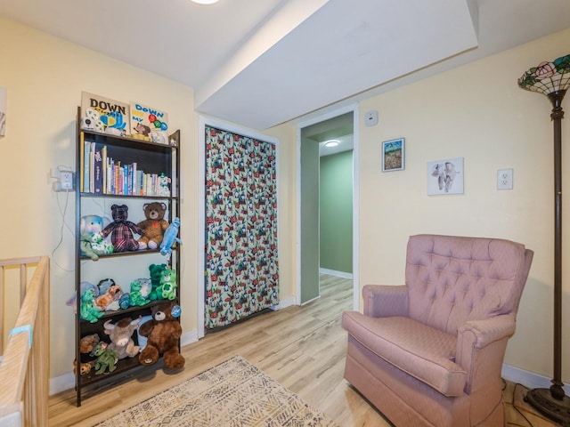 2300 Locust St, West Des Moines, IA 50265 - sitting room featuring wood finished floors and baseboards