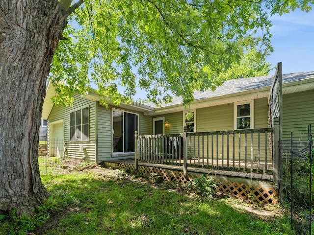 2300 Locust St, West Des Moines, IA 50265 - back of house featuring a wooden deck and a garage