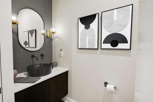 710 Peace St Unit 3D, Pella, IA 50219 - bathroom with vanity and backsplash