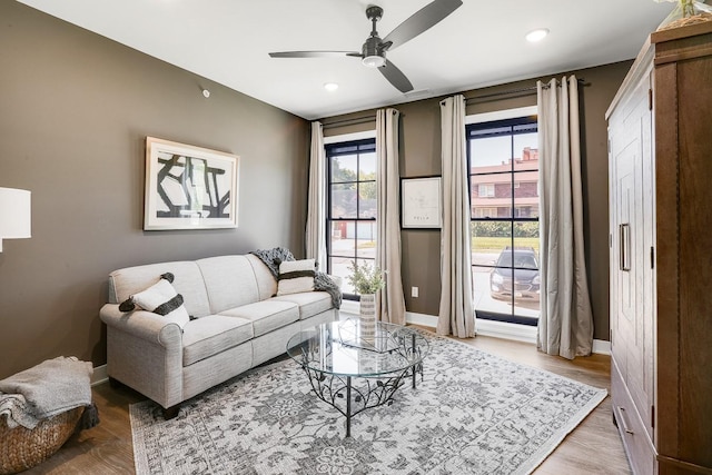 710 Peace St Unit 3D, Pella, IA 50219 - living area with ceiling fan, wood finished floors, and recessed lighting