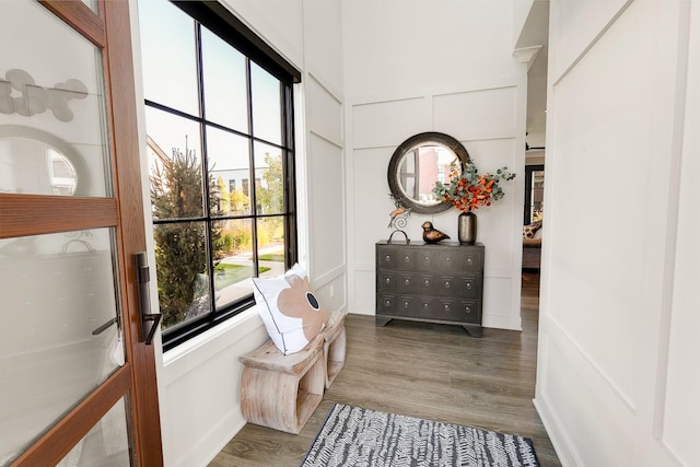 710 Peace St Unit 3D, Pella, IA 50219 - living area featuring wood finished floors and a decorative wall