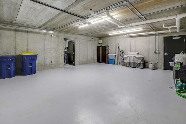 710 Peace St Unit 3D, Pella, IA 50219 - garage with a garage door opener