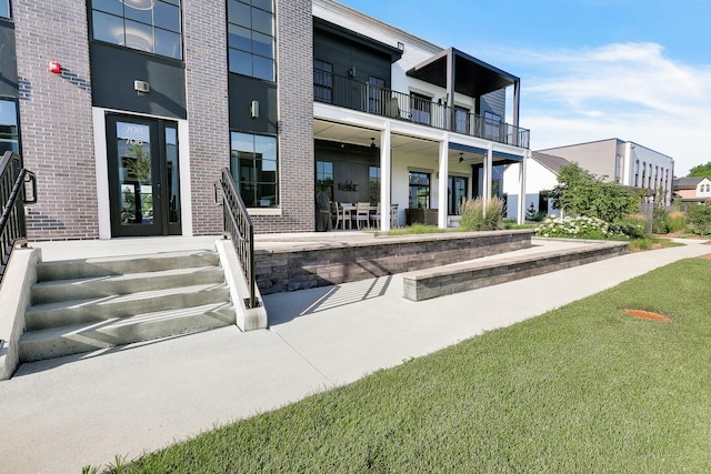 710 Peace St Unit 3D, Pella, IA 50219 - view of exterior entry featuring brick siding