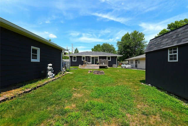 3600 Brinkwood Rd, Des Moines, IA 50310 - view of grassy yard featuring a deck