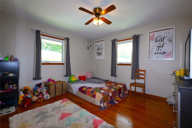 3600 Brinkwood Rd, Des Moines, IA 50310 - bedroom featuring multiple windows, wood finished floors, and ceiling fan