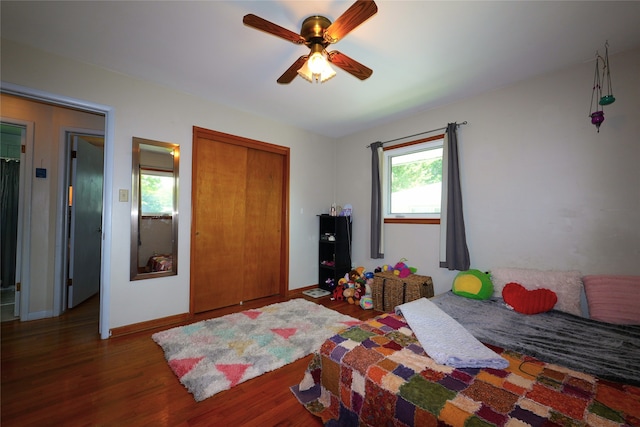 3600 Brinkwood Rd, Des Moines, IA 50310 - bedroom featuring wood finished floors, a closet, and a ceiling fan