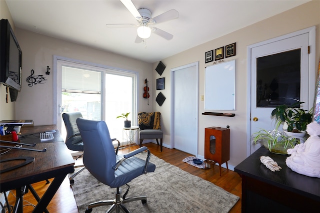 3600 Brinkwood Rd, Des Moines, IA 50310 - home office featuring wood finished floors and a ceiling fan