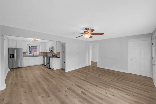 1515 Chance Ct, Adel, IA 50003 - unfurnished living room featuring light wood finished floors and a ceiling fan