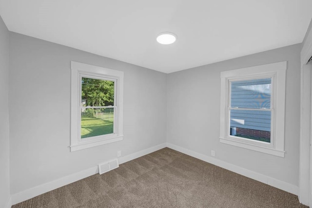 1515 Chance Ct, Adel, IA 50003 - unfurnished room with dark colored carpet and baseboards
