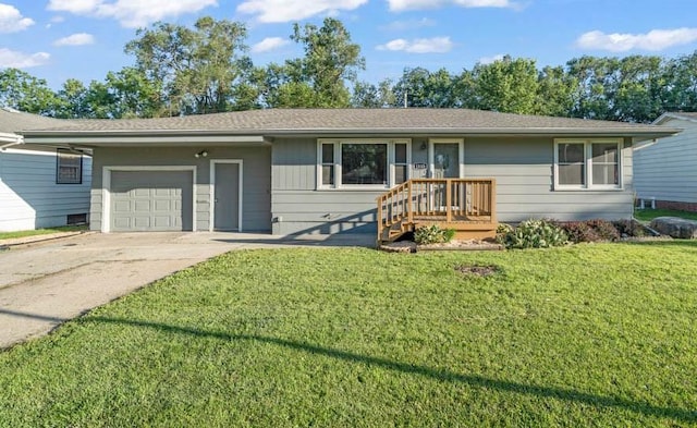 1515 Chance Ct, Adel, IA 50003 - ranch-style house featuring concrete driveway, an attached garage, and a front lawn