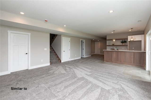 790 Hamilton Rd, Waukee, IA 50263 - unfurnished living room featuring light colored carpet, recessed lighting, and stairway