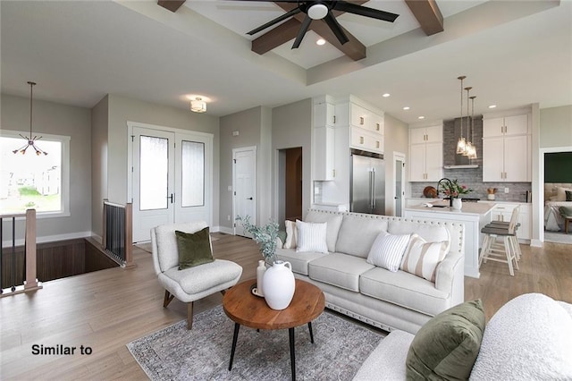 790 Hamilton Rd, Waukee, IA 50263 - living area with a chandelier, light wood-style floors, ceiling fan, recessed lighting, and beam ceiling