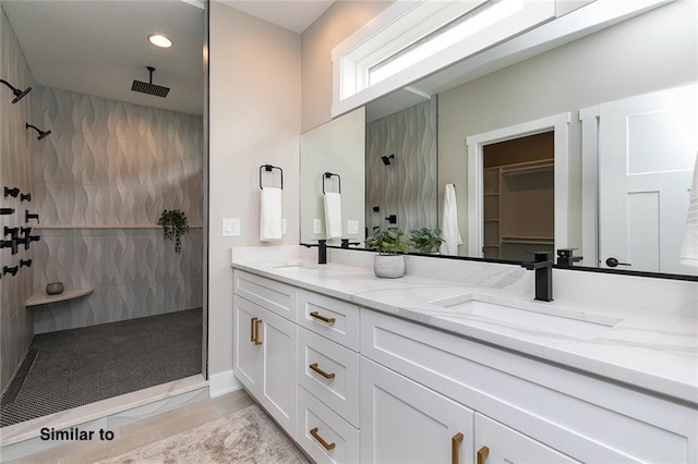 790 Hamilton Rd, Waukee, IA 50263 - full bathroom with walk in shower, double vanity, recessed lighting, and a spacious closet