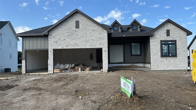 790 Hamilton Rd, Waukee, IA 50263 - view of front of property featuring stone siding and an attached garage