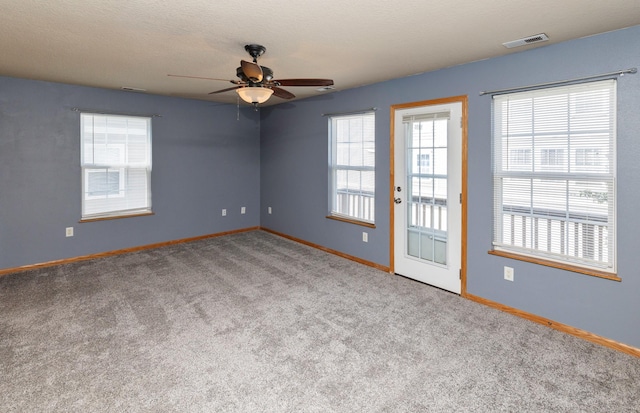 1115 Fieldstone Ln, Pleasant Hill, IA 50327 - empty room featuring a ceiling fan, carpet flooring, and healthy amount of natural light