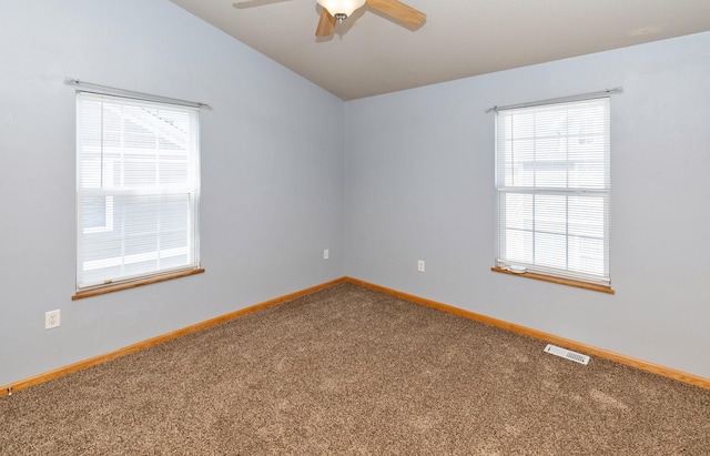 1115 Fieldstone Ln, Pleasant Hill, IA 50327 - spare room with carpet flooring, a ceiling fan, and vaulted ceiling