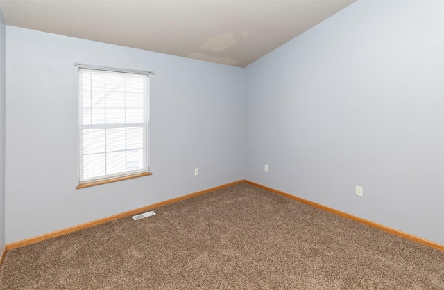 1115 Fieldstone Ln, Pleasant Hill, IA 50327 - carpeted empty room featuring plenty of natural light and vaulted ceiling