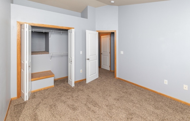 1115 Fieldstone Ln, Pleasant Hill, IA 50327 - unfurnished bedroom featuring carpet floors, a closet, and lofted ceiling