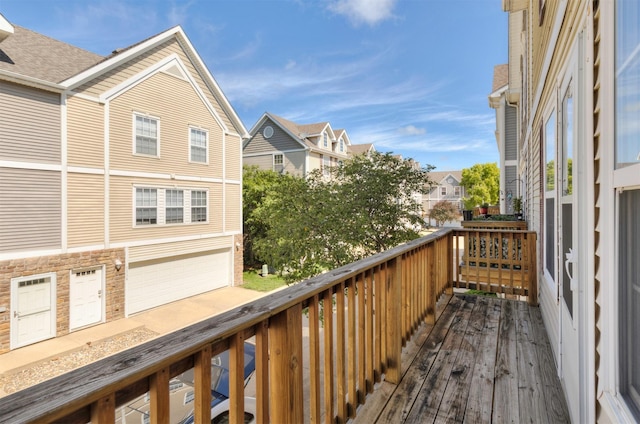 1115 Fieldstone Ln, Pleasant Hill, IA 50327 - wooden deck featuring a residential view and a garage