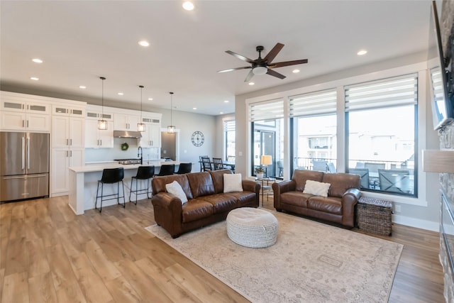 17965 Hammontree Cir, Clive, IA 50325 - living room featuring light wood finished floors, recessed lighting, and ceiling fan