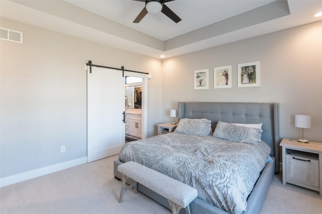 17965 Hammontree Cir, Clive, IA 50325 - bedroom with light carpet, a barn door, recessed lighting, ceiling fan, and a raised ceiling