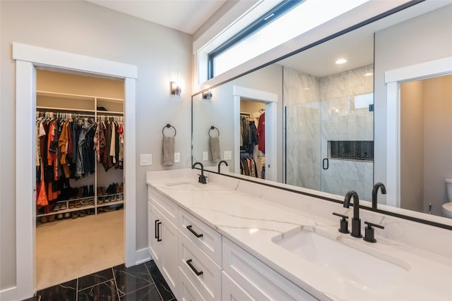 17965 Hammontree Cir, Clive, IA 50325 - full bathroom featuring marble look tile flooring, double vanity, a spacious closet, and a stall shower