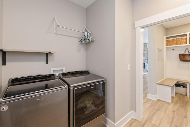 17965 Hammontree Cir, Clive, IA 50325 - laundry room with washer and dryer and light wood-style floors
