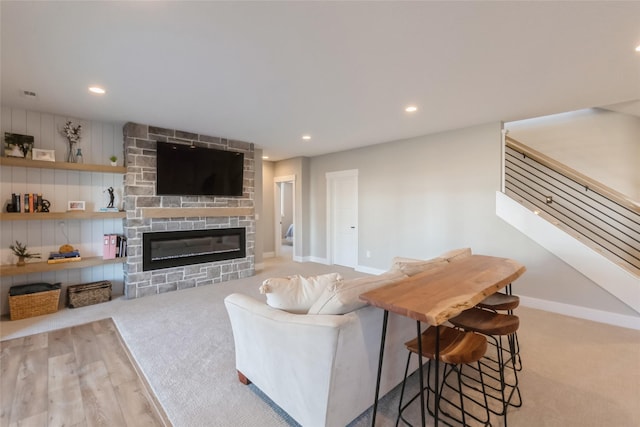17965 Hammontree Cir, Clive, IA 50325 - living room featuring a fireplace, carpet flooring, recessed lighting, and stairway