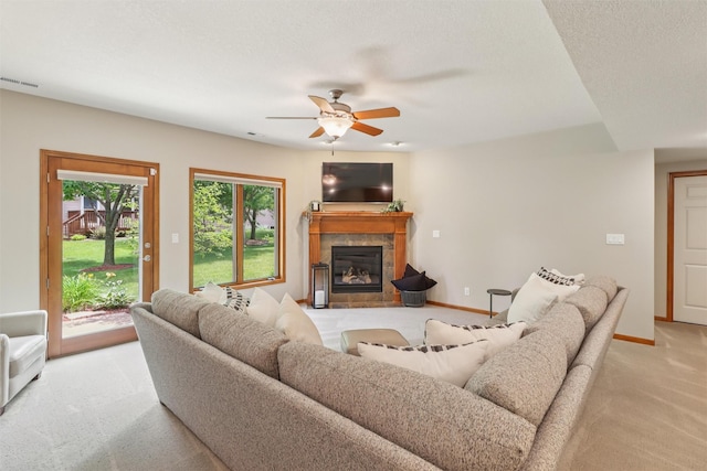 3607 152nd St, Urbandale, IA 50323 - living area with light colored carpet, ceiling fan, and a fireplace