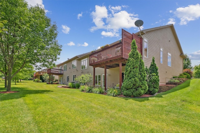 3607 152nd St, Urbandale, IA 50323 - rear view of property with a wooden deck and a lawn