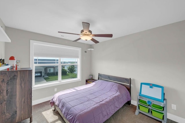1965 SE Waddell Way, Waukee, IA 50263 - carpeted bedroom featuring baseboards and ceiling fan