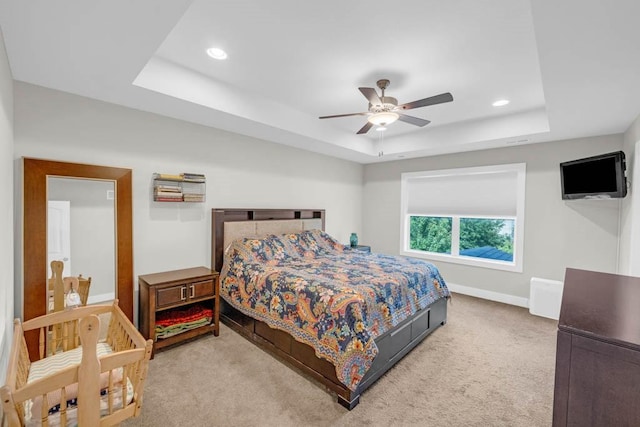 1965 SE Waddell Way, Waukee, IA 50263 - bedroom with a tray ceiling, carpet floors, recessed lighting, and ceiling fan