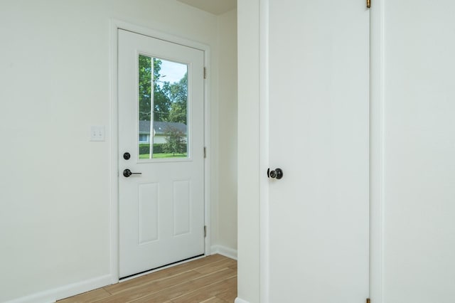 1205 Elder Ln, Des Moines, IA 50315 - doorway with light wood-style floors and baseboards