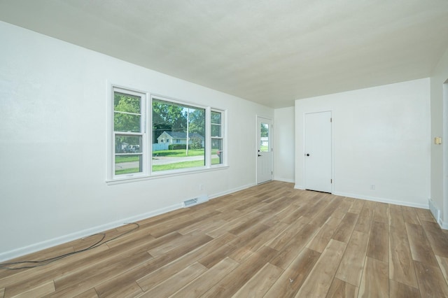 1205 Elder Ln, Des Moines, IA 50315 - spare room with light wood finished floors and baseboards