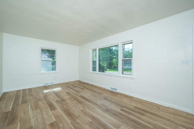 1205 Elder Ln, Des Moines, IA 50315 - empty room with light wood-style floors and baseboards