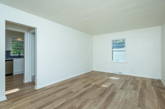 1205 Elder Ln, Des Moines, IA 50315 - spare room featuring light wood-style floors