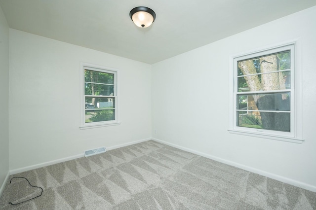 1205 Elder Ln, Des Moines, IA 50315 - carpeted spare room featuring healthy amount of natural light
