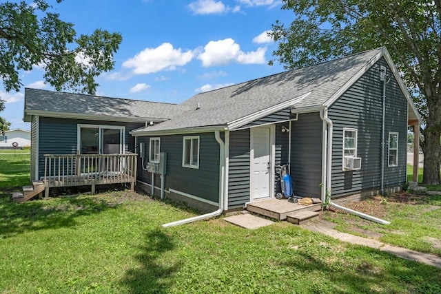 1020 SW 3rd St, Nevada, IA 50201 - rear view of house with a yard, cooling unit, a shingled roof, and a wooden deck