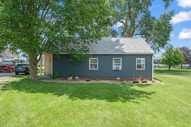 1020 SW 3rd St, Nevada, IA 50201 - view of home's exterior with a shingled roof, a lawn, and crawl space