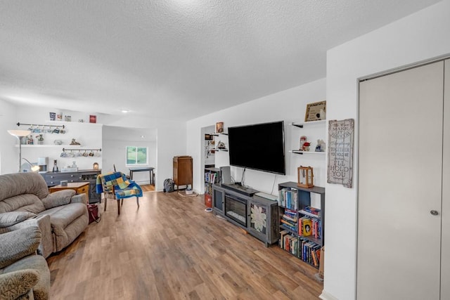1020 SW 3rd St, Nevada, IA 50201 - living area with a textured ceiling and wood finished floors